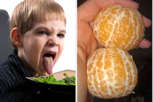 Child making a disgusted face at a plate of peas; hand holding two peeled oranges